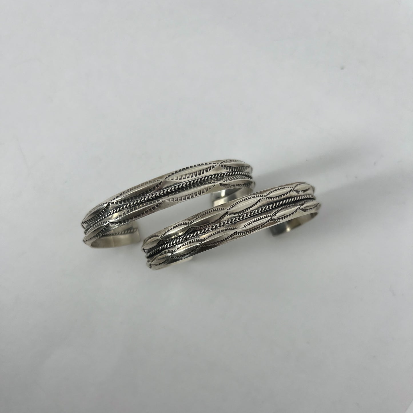 NAVAJO STAMPED SILVER BRACELET by ROBERT CADMAN var.1