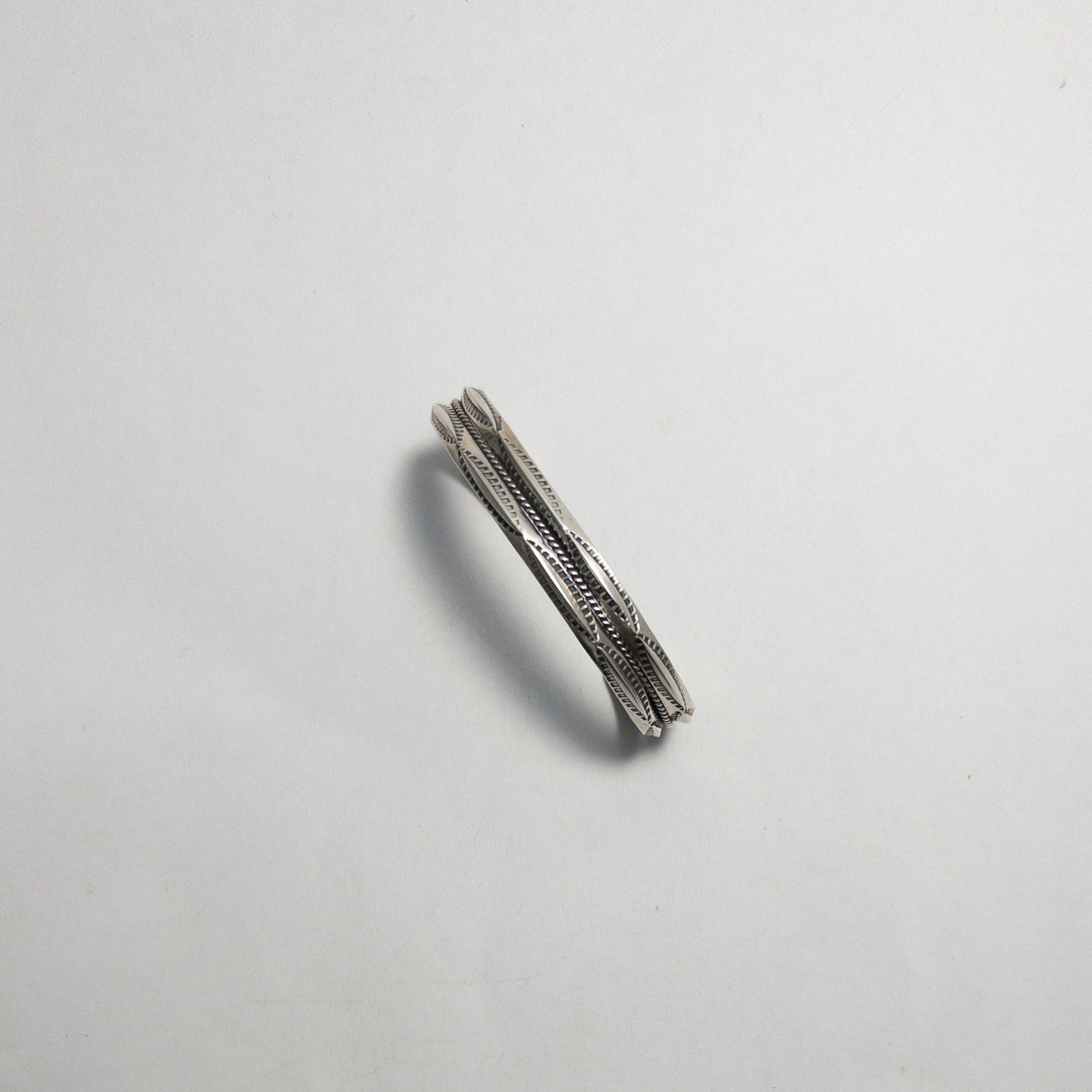 NAVAJO STAMPED SILVER BRACELET by ROBERT CADMAN var.1