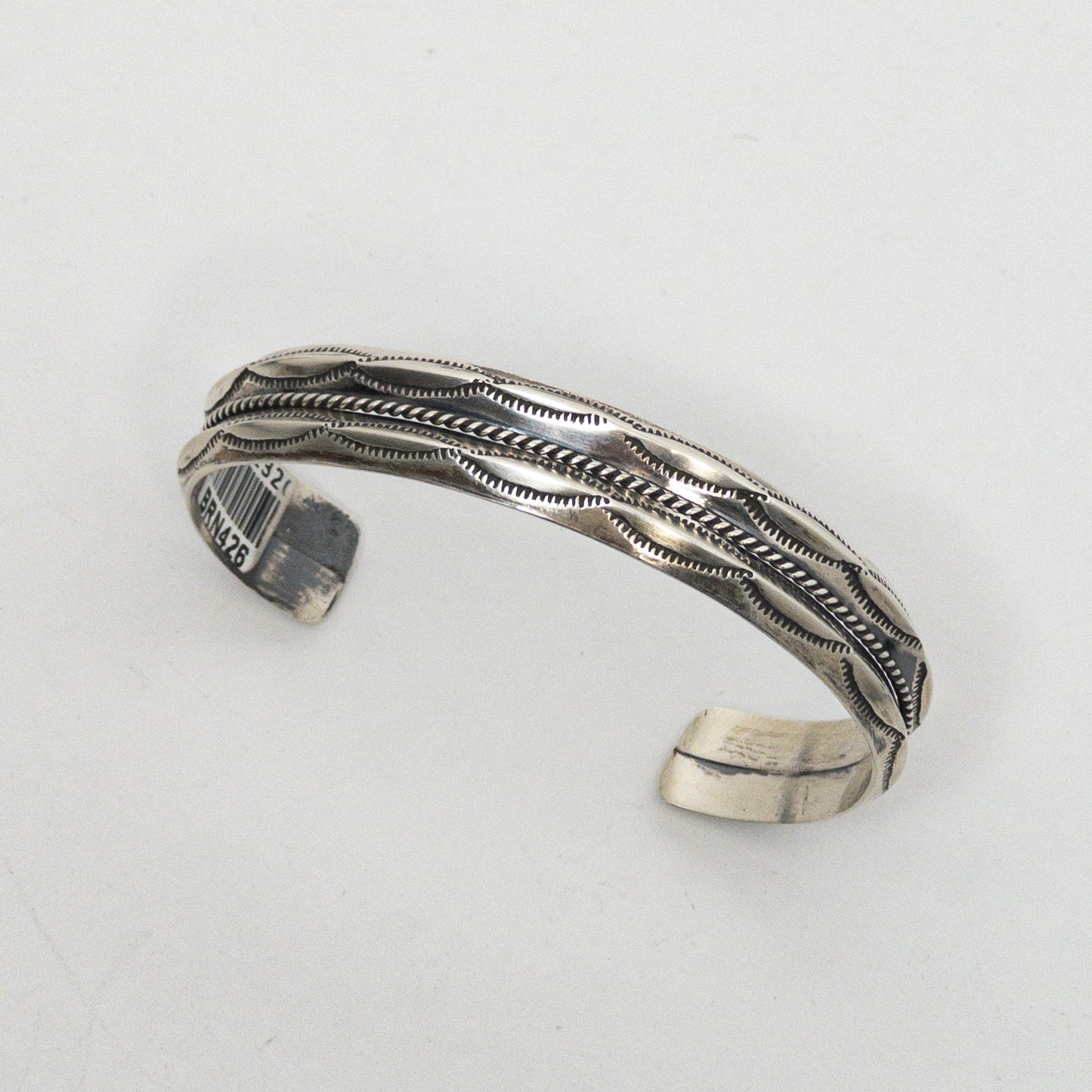 NAVAJO STAMPED SILVER BRACELET by ROBERT CADMAN var.2
