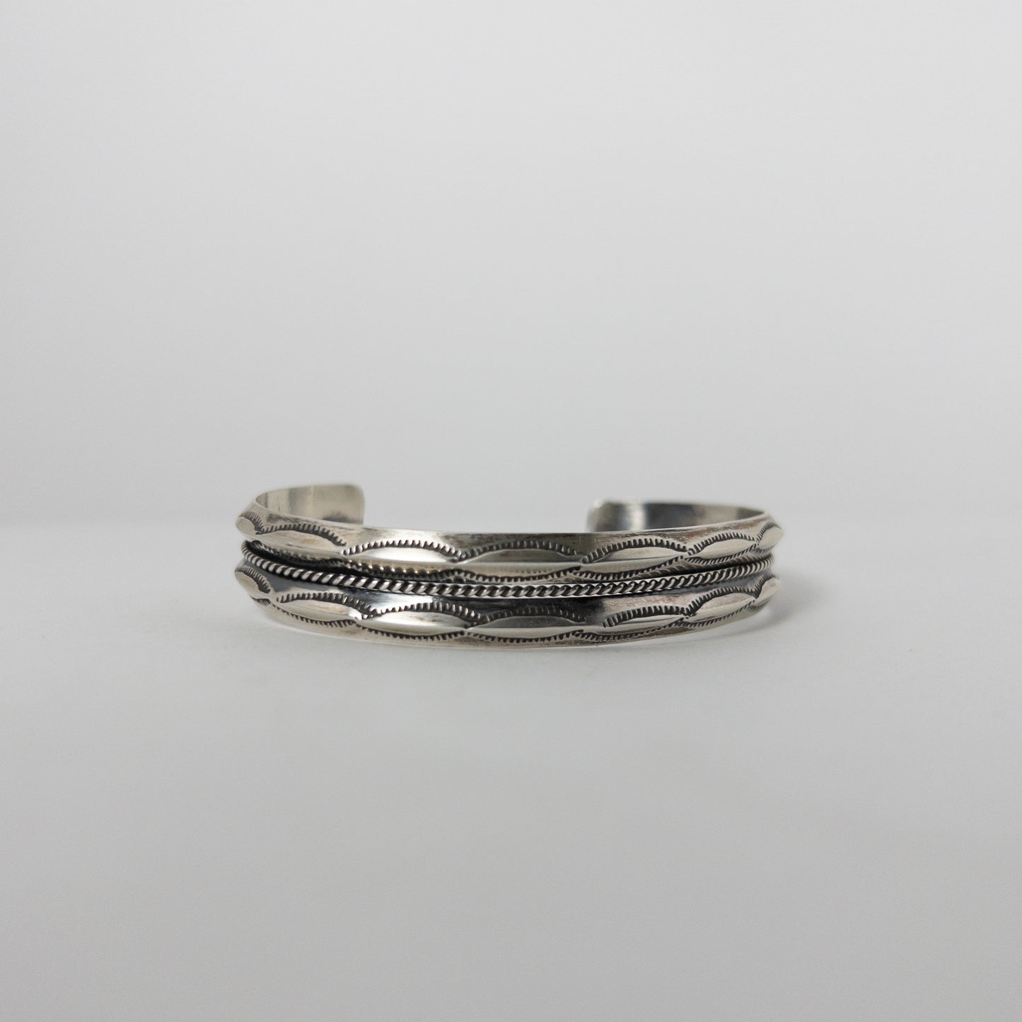 NAVAJO STAMPED SILVER BRACELET by ROBERT CADMAN var.2