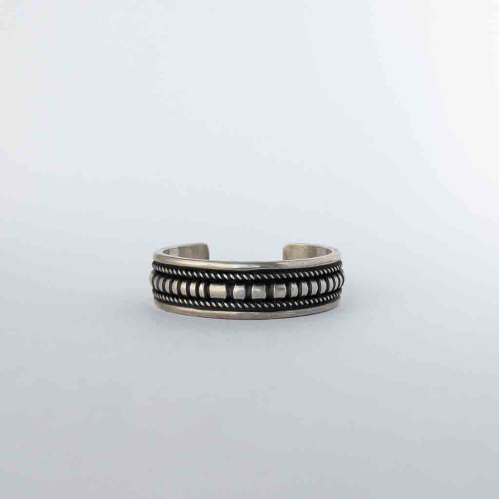NAVAJO HEAVY STAMPED BRACELET by LEANDER TAHE