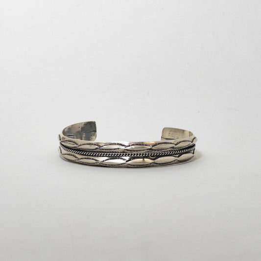 NAVAJO STAMPED SILVER BRACELET by ROBERT CADMAN var.2